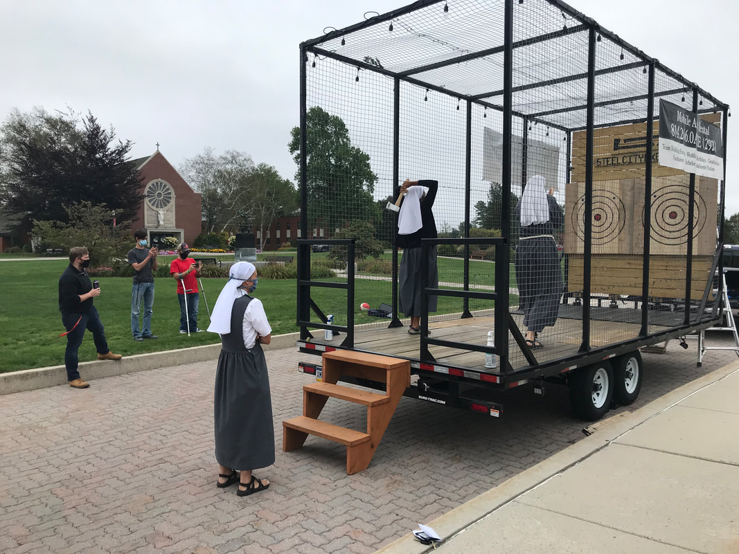 The Steel City axe throwing trailer set up for a college campus event